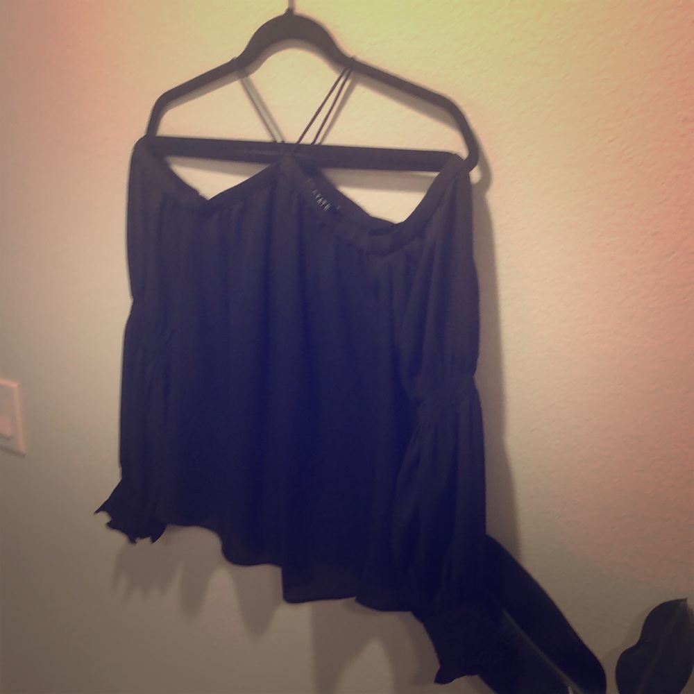 Off shoulder black top.